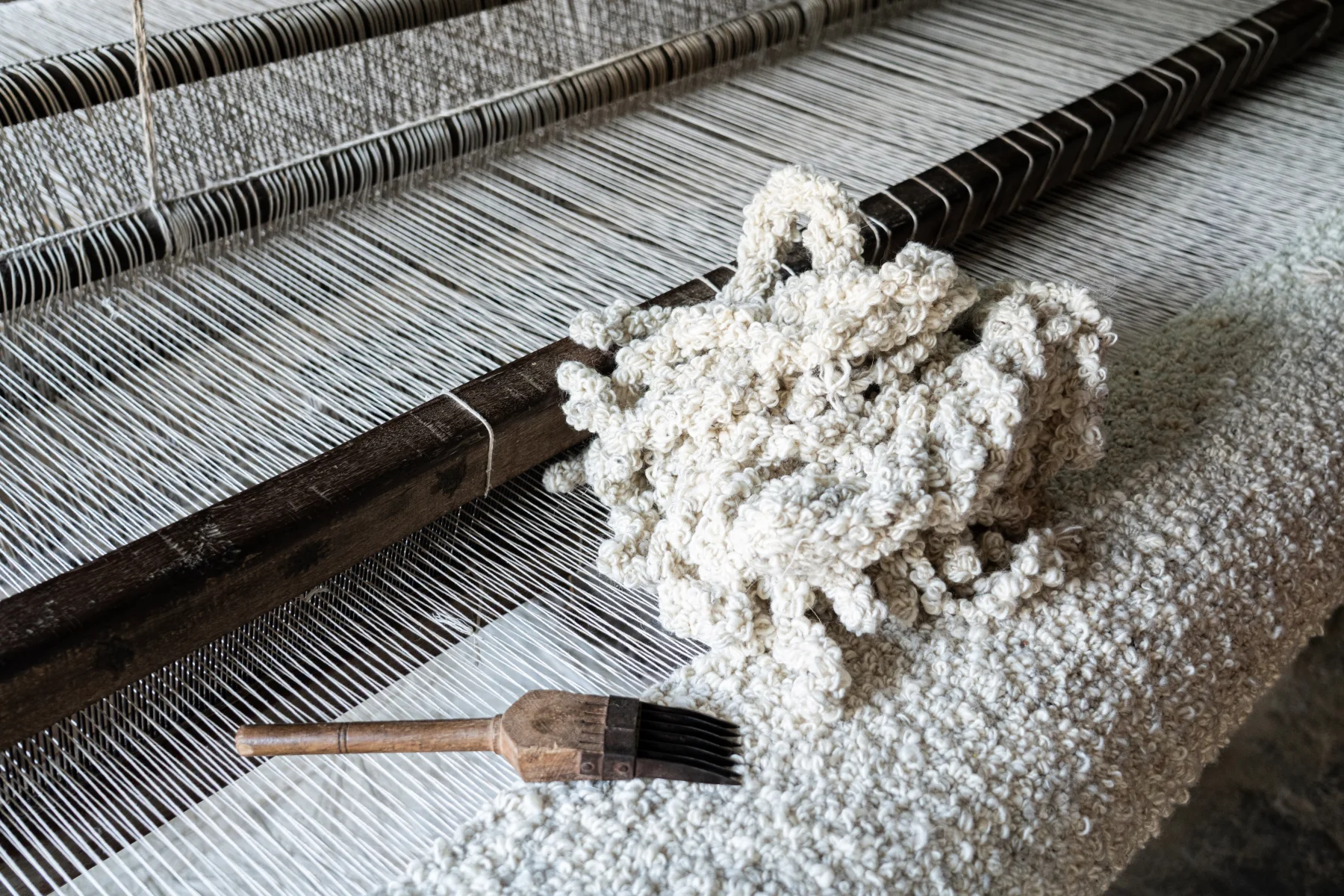 Hand finishing detail during rug making